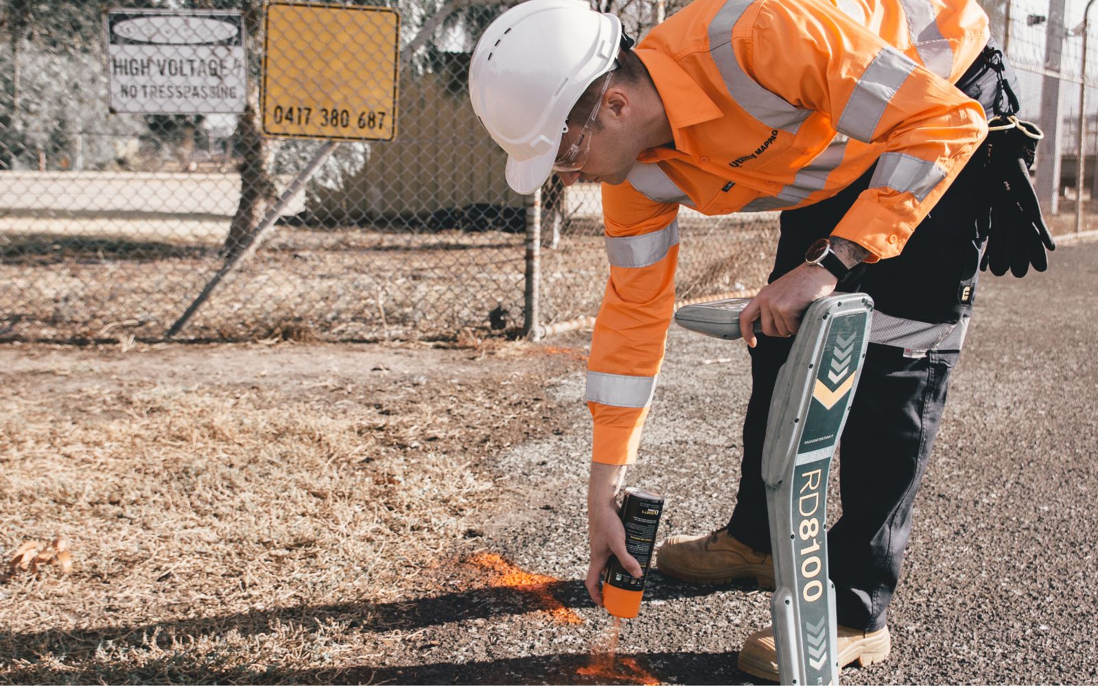 Utility Mapping locator marking out underground utilities on a work-site.